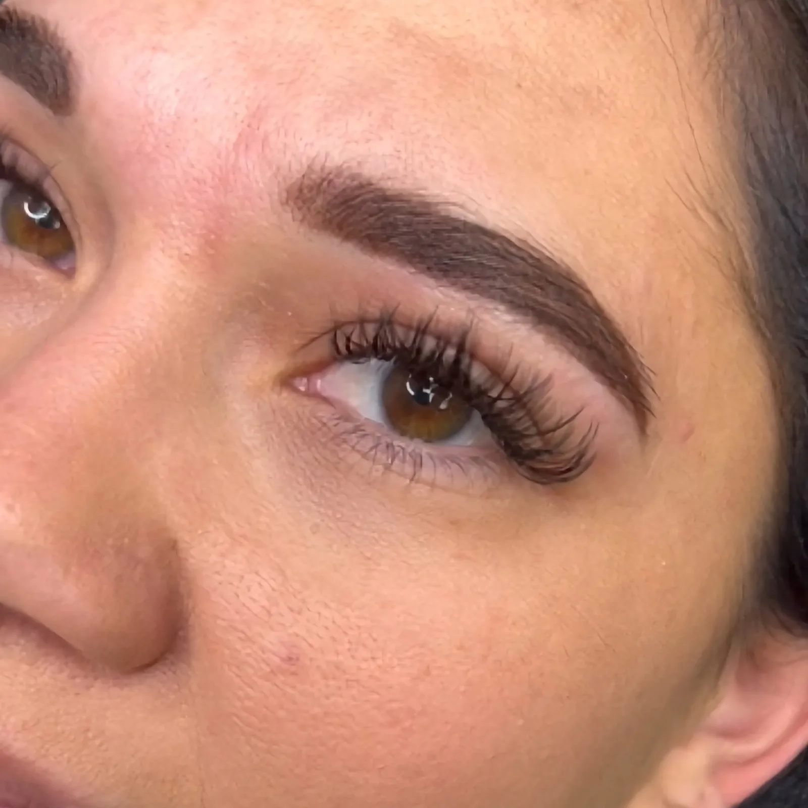 Close-up of a client’s shaped and defined brows at Blink & Slay Beauty.