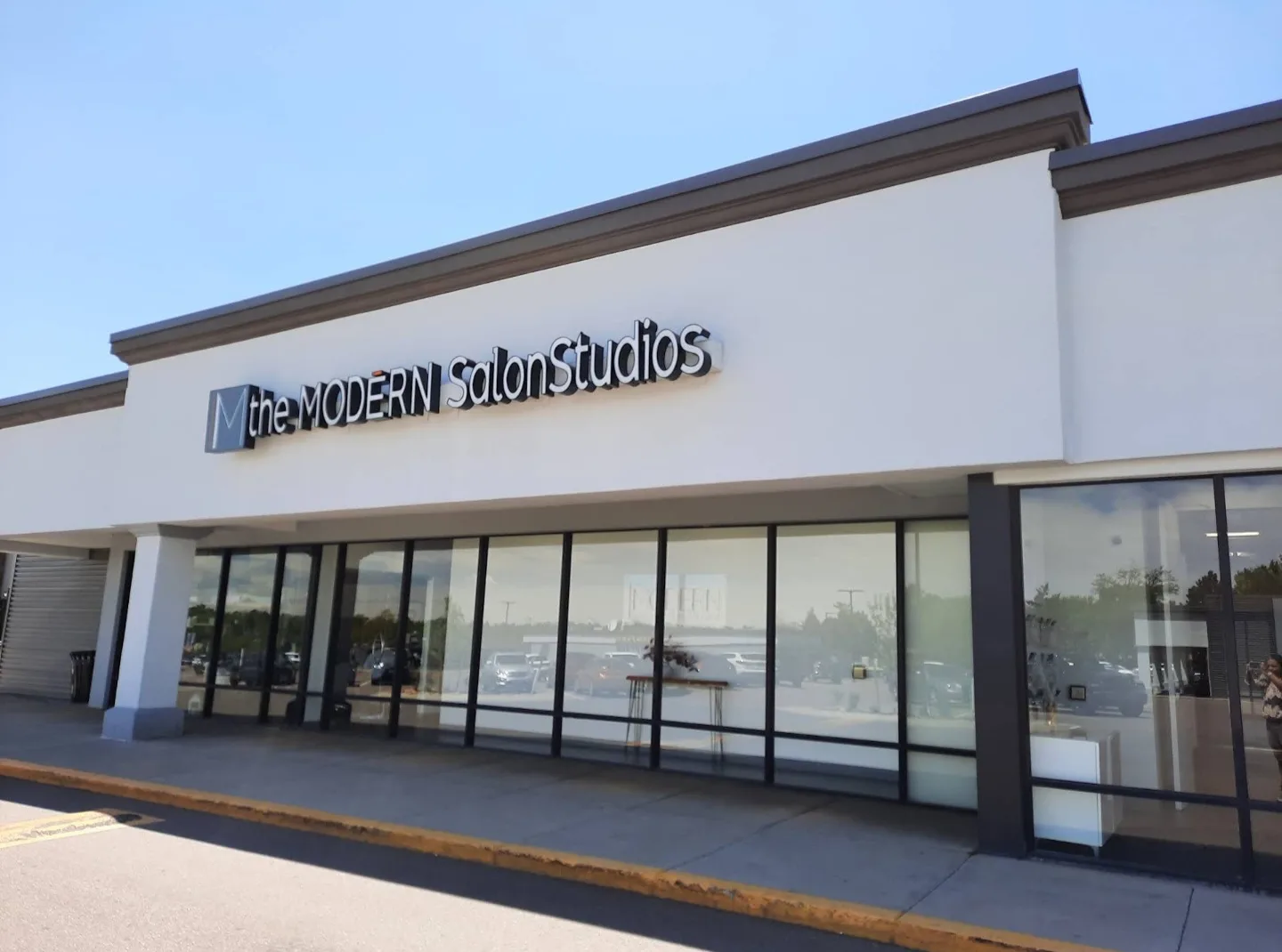 The Modern Salon Studios storefront on E Quincy Ave, where Blink & Slay Beauty is located.